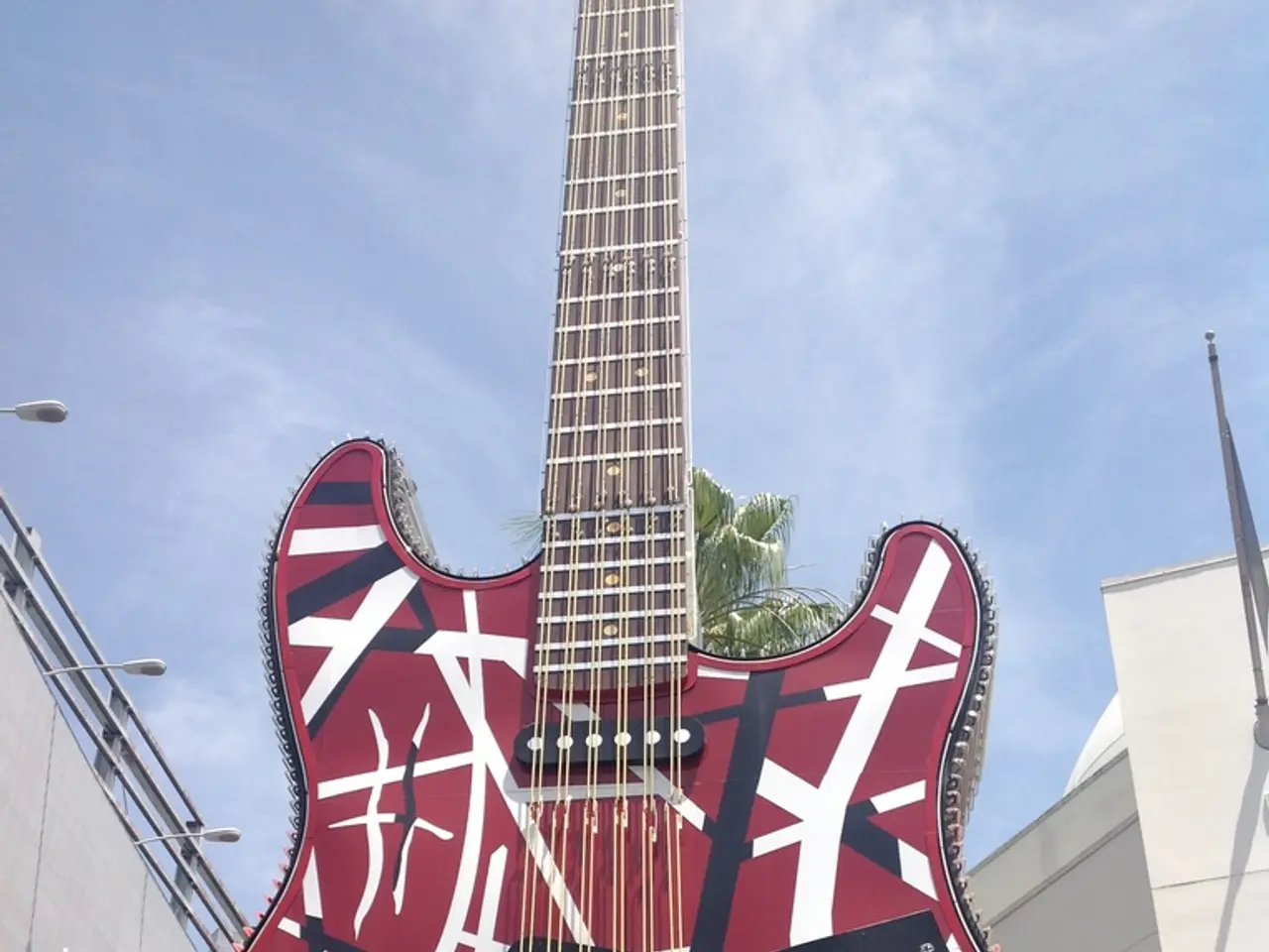 This guitar is highlighted in this picture. Sky is cloudy.