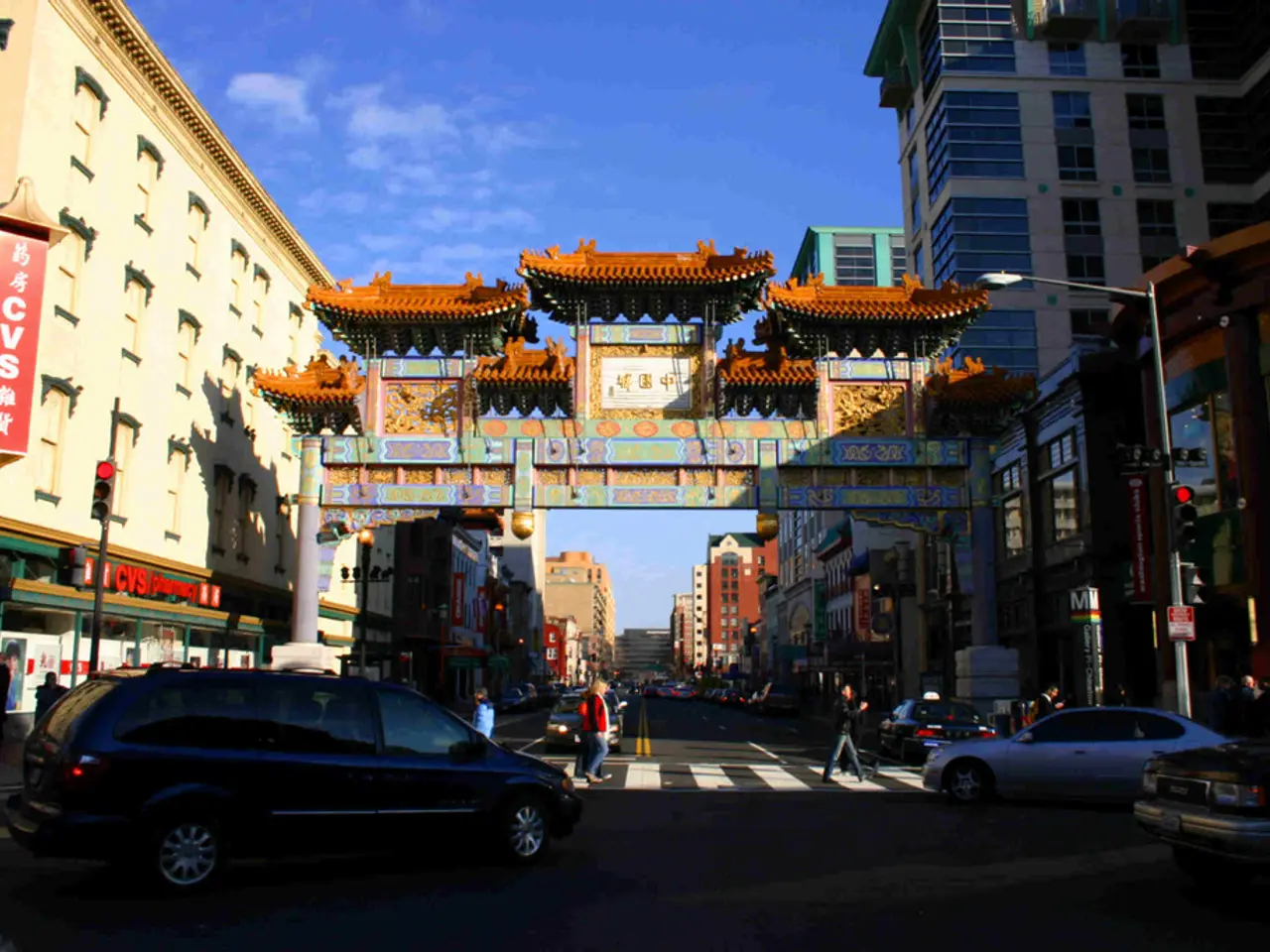 In this picture I can see there is a road and there are few vehicles moving on the road and there...