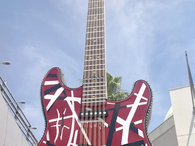 This guitar is highlighted in this picture. Sky is cloudy.