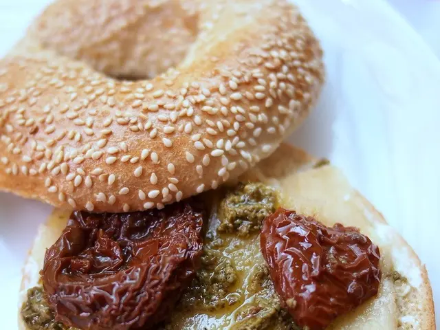 This image consists of some eatables. It looks like a burger.