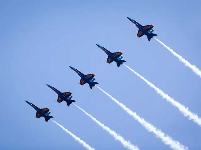 This picture shows few jet planes releasing smoke all are blue and yellow in color and we see blue...